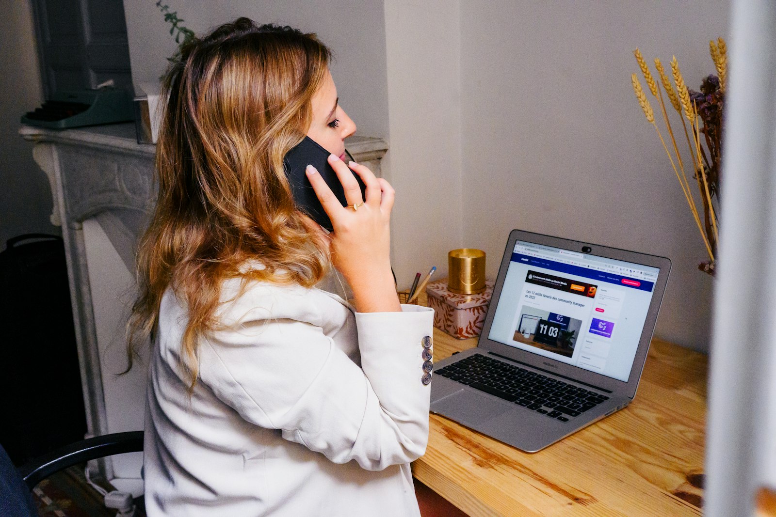 Travel consultant on a phone call at her desk